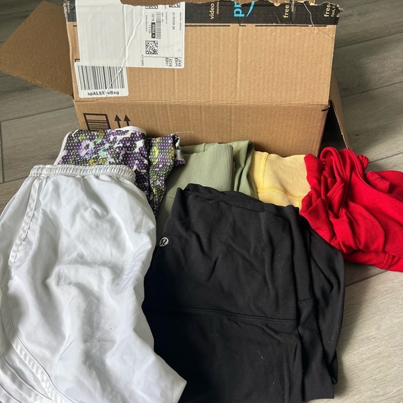 lululemon athletica Tops - Lululemon and athletic mystery reseller box picture shows what could be included